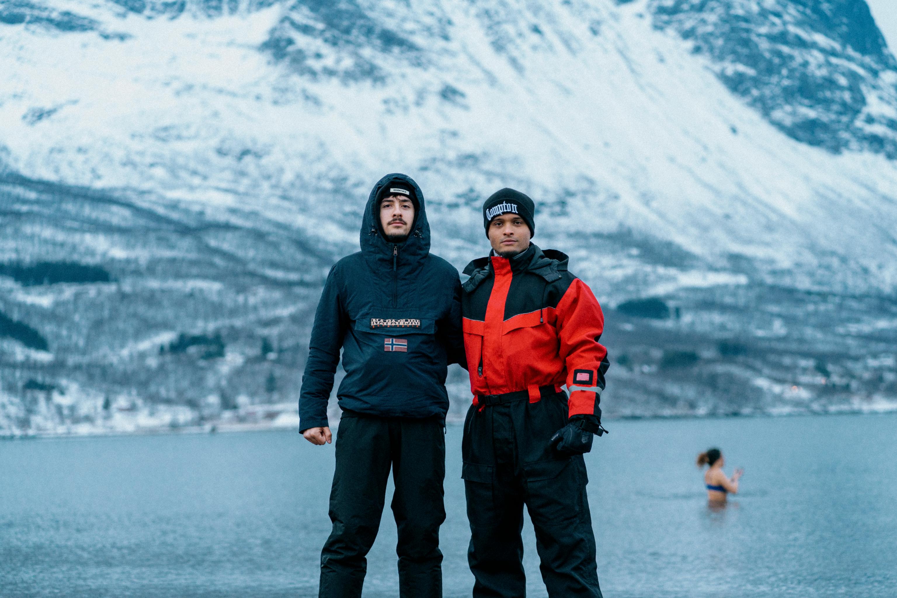 Two guys with Norwegian fjord in the background.